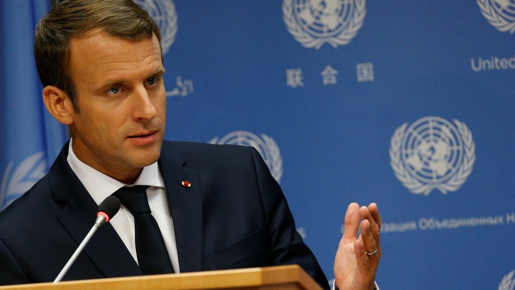 In an allusion to Donald Trump, Emmanuel Macron said: “While some would like to stop, we must continue to advance, to go farther. Because global warming does not stop.” Photograph: Brendan McDermid/Reuters