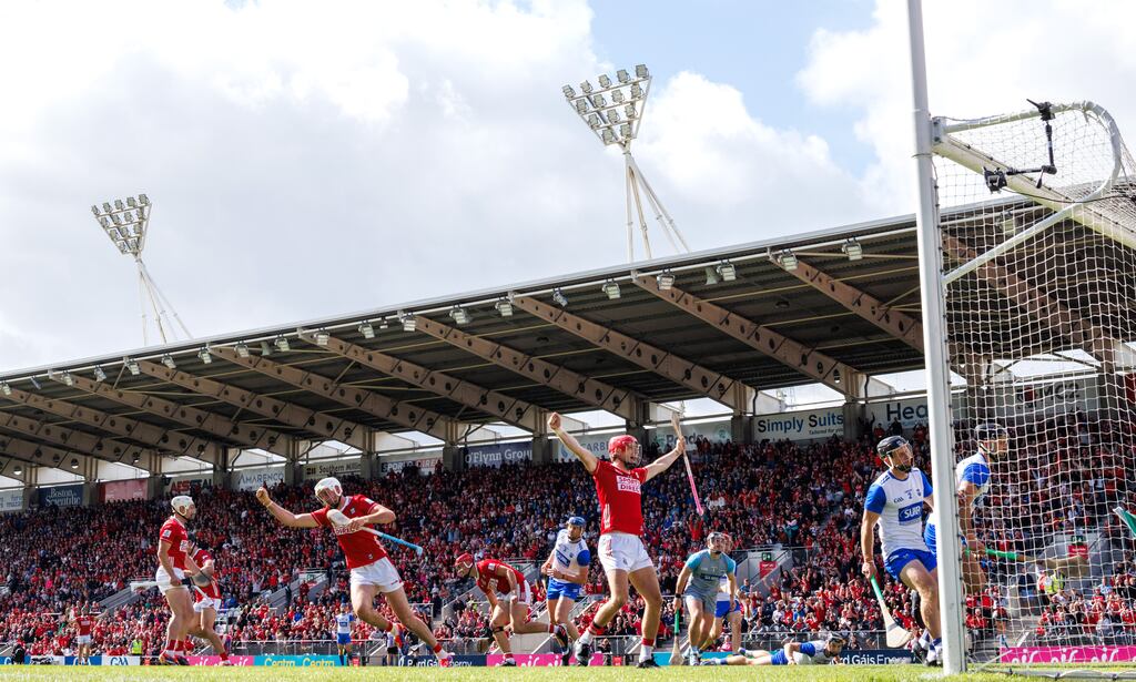 Tim O'Mahony and Alan Connolly celebrate after Brian Hayes scores Cork's opening goal. Photograph: James Crombie/Inpho