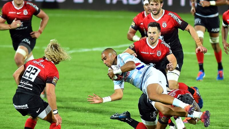 Racing’s Irish fullback Simon Zebo is tackled during the French Top 14 match against Toulouse at Stade Ernest Wallon. Photograph: Remy Gabalda/AFP via Getty Images