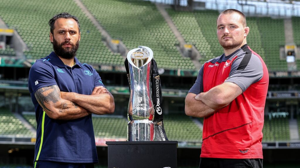Leinster’s Isa Nacewa and Scarlets’s Ken Owens pose with the Pro14 trophy ar Aviva Stadium ahead of the final. Photograph: Dan Sheridan/Inpho