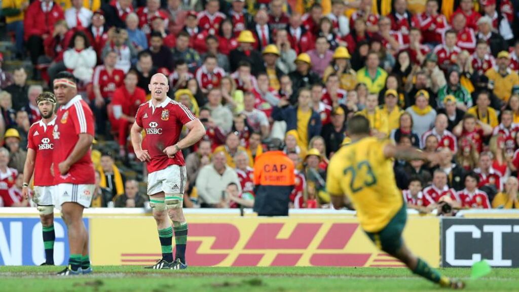 Australia’s Kurtley Beale slips as he takes a penalty that would have won his team the match while Lions players look on. Photograph: Dan Sheridan/Inpho