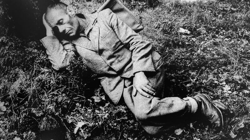 Man sleeping on ground under a tree. LevoÄ?a 1968. Photograph: Markéta LuskaÄ?ová.