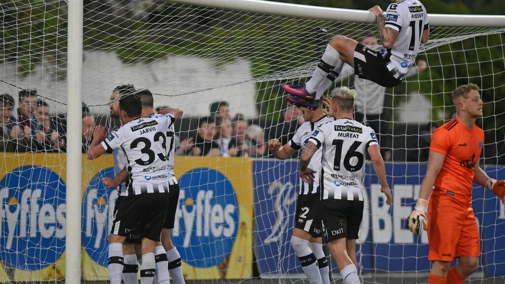 Dundalk celebrate Patrick Hoban’s late winning penalty against Bohemians. Photograph: Ciaran Culligan/Inpho