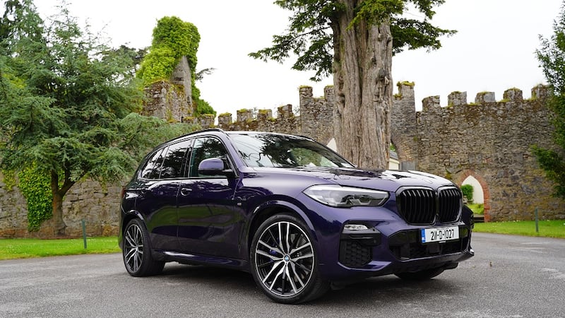 Old meets new: The BMW X5 xDrive 45e stands out against the ramparts of Castlemartyr’s 13th-century Knights Templar-built castle