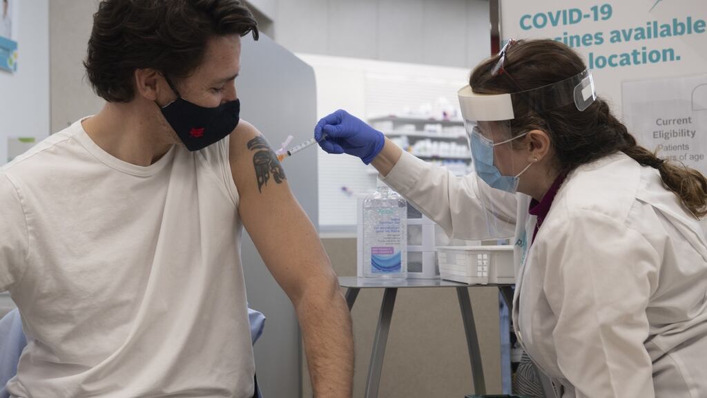 Justin Trudeau, Canada’s prime minister, receives a dose of the AstraZeneca Covid-19 vaccine in a pharmacy in Ottawa, Ontario, Canada. Photograph: Adrian Wyld/CP/Bloomberg