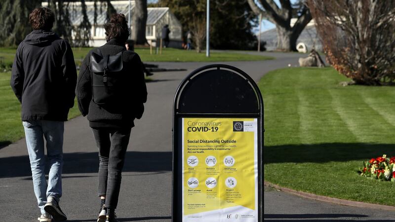 A sign displaying guidance on social distancing in the Botanic Gardens in Dublin. Photograph: Brian Lawless/PA Wire