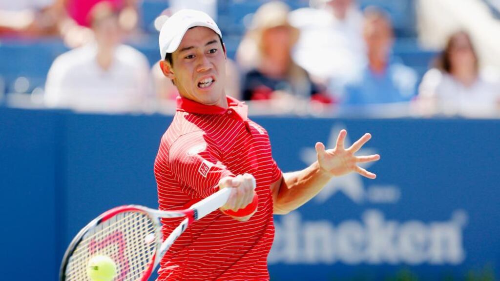 Kei Nishikori of Japan returns a shot against Novak Djokovic of Serbia during their men’s singles semi-final at the 2014 US Open at the USTA Billie Jean King National Tennis Center, New York City. Photograph: Mike Stobe/Getty Images