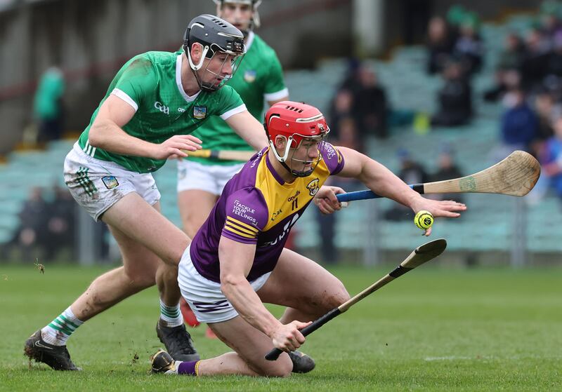 Limerick's Diarmaid Byrnes in action against Lee Chin of Wexford during the Allianz Hurling League Division 1A game at the TUS Gaelic Grounds. Photograph: Lorraine O’Sullivan/Inpho