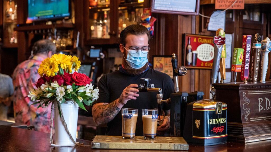 A bartender pours drinks at a bar in Austin, Texas. Texas governor Greg Abbott ordered bars to close on Friday amid a surge in coronavirus cases in the state. File photograph: Sergio Flores/AFP via Getty Images