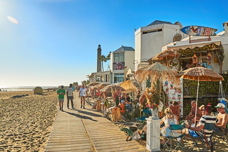 An winter promenade on the boardwalk at Maspalomas, Gran Canaria