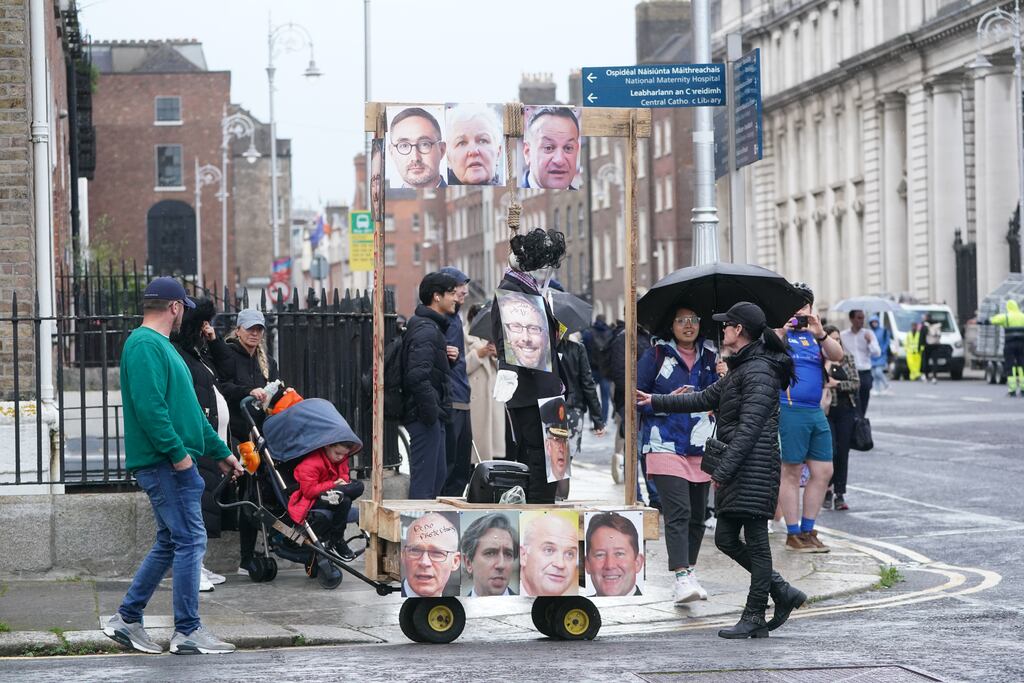 The mock gallows that was erected outside Leinster House on Wednesday was covered in pictures of prominent politicians. Photograph: Brian Lawless/PA Wire