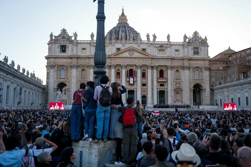 People gathered at Saint Peter's Square listen to newly elected Pope Leo XIV address the crowd from the balcony of St Peter's Basilica. Photograph: Dimitar Dilkoff/AFP via Getty Images