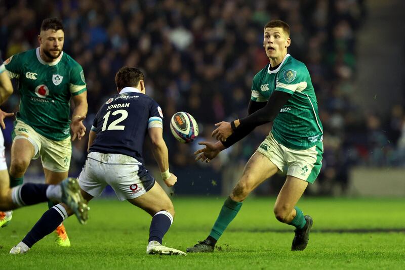 Ireland's progressive Sam Prendergast passes to Robbie Henshaw. Photograph: Dan Sheridan/Inpho