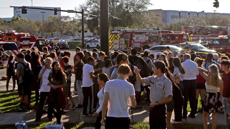 Students are released from a lockdown following a mass shooting at Marjory Stoneman Douglas High School in Parkland, Florida. Photograph: John McCall/South Florida Sun-Sentinel via AP