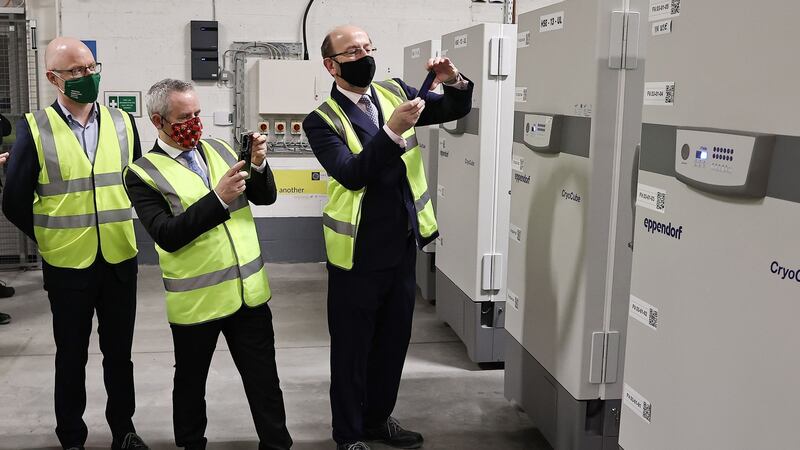 Minister for Health Stephen Donnelly, Paul Reid of the HSE and Prof Brian Mac Craith of the high-level task force for the vaccination, with the first doses of the Pfizer BioNTech vaccine on Saturday. Photograph: Marc O’Sullivan/Pool/AFP via Getty Images