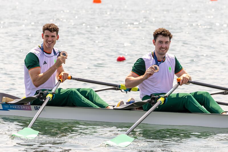 Philip Doyle and Daire Lynch celebrate with their bronze medals in the men's double sculls. Photograph: Morgan Treacy/Inpho