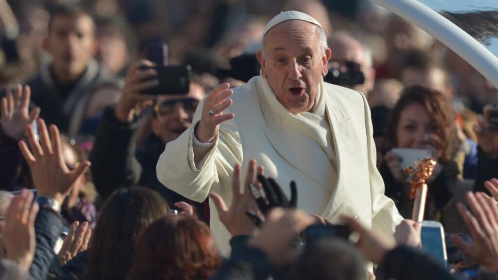 Meeting the faithful: Pope Francis greets the crowd as he arrives for his general audience at St Peter’s Square . Photograph: Vincenzo Pinto/AFP/Getty Images