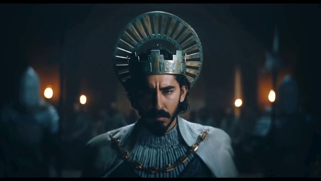 Dev Patel is Gawain, a whoring, hardly noble knight with a claim to the throne