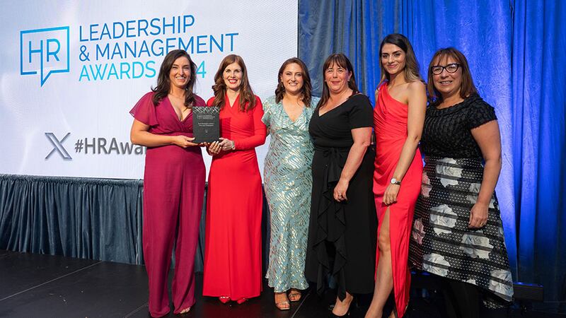 Miriam Manning, awards judge, presents the best workplace (large - over 250+ employees) award to the Cpl team