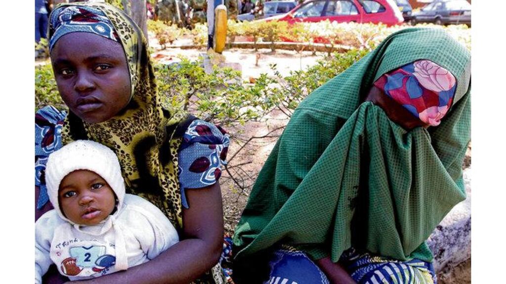 Hauwa Ahmed, right, cries after losing her son to violence in Jos, Nigeria, yesterday. Photograph: (AP Photo/Sunday Alamba)
