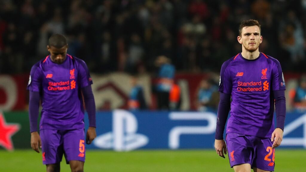 Liverpool’s Georginio Wijnaldum   and Andy Robertson  react at the final whistle having lost 2-0 to     Red Star Belgrade. Photograph: Srdjan Suki/EPA
