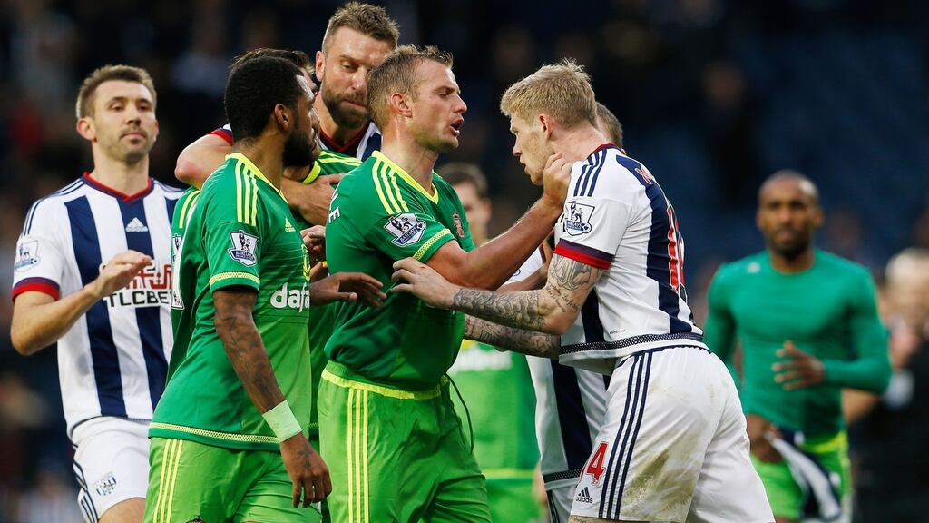 West Brom’s James McClean clashes with Sunderland’s Lee Cattermole and Danny Graham at full time after celebrating in front of Sunderland fans. Photo: Lee Smith/Reuters