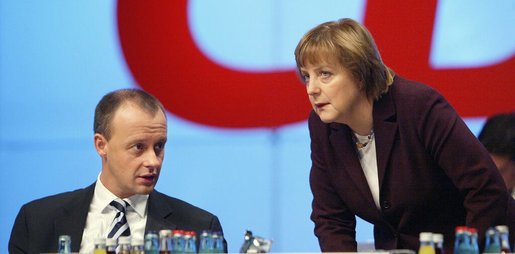 Friedrich Merz Angela Merkel speak prior to a speech by him on tax reform at the CDU party congress in Leipzig in December 2003. Years later, Merkel thwarted Merz's ambitions to succeed her as CDU leader. Photograph: Sean Gallup/Getty Images