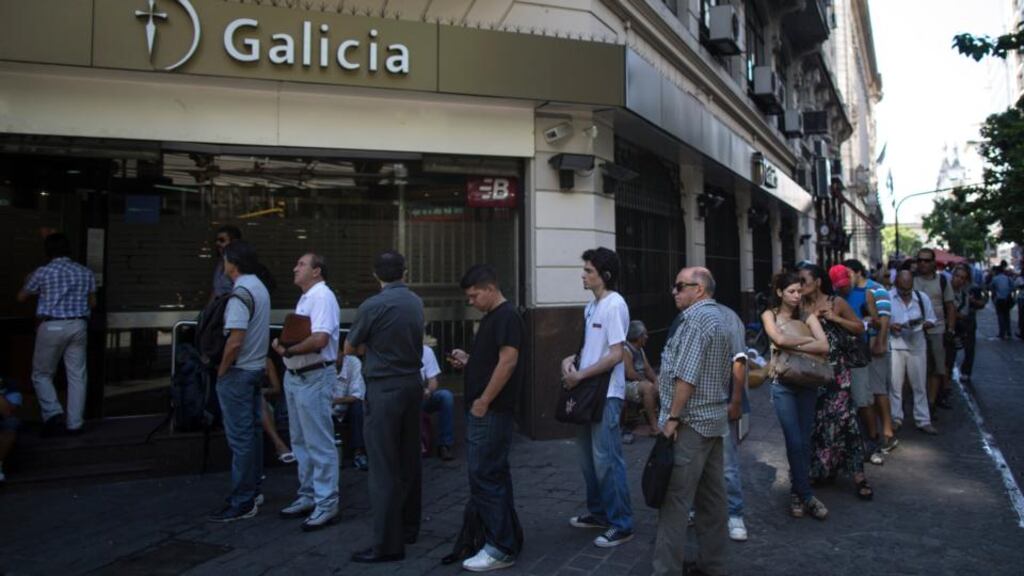 People are lined up outside Galicia bank to buy dollars in Buenos Aire