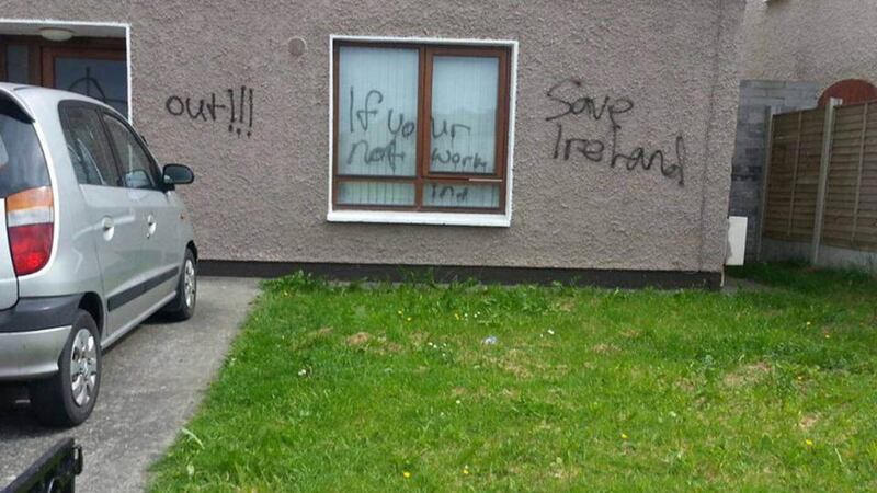 Slogans painted on the home of an immigrant family. Photograph: Immigrant Council of Ireland