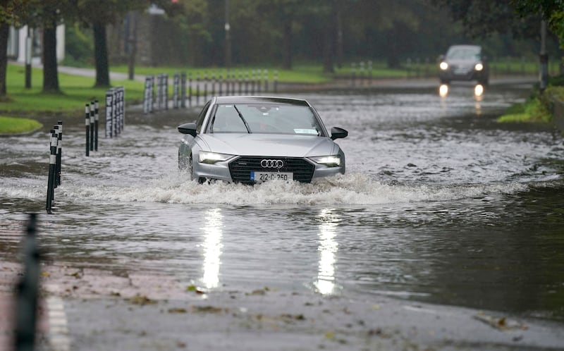 Storm Agnes: A car driving through floodwater in Cork. Photograph: Niall Carson/PA Wire