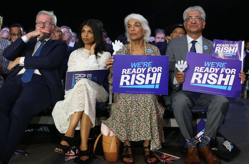 Akshata Murthy, wife of Rishi Sunak, sits with his parents Usha Sunak and Yashvir Sunak, and Conservative MP Michael Gove. Photograph: Susannah Ireland/AFP