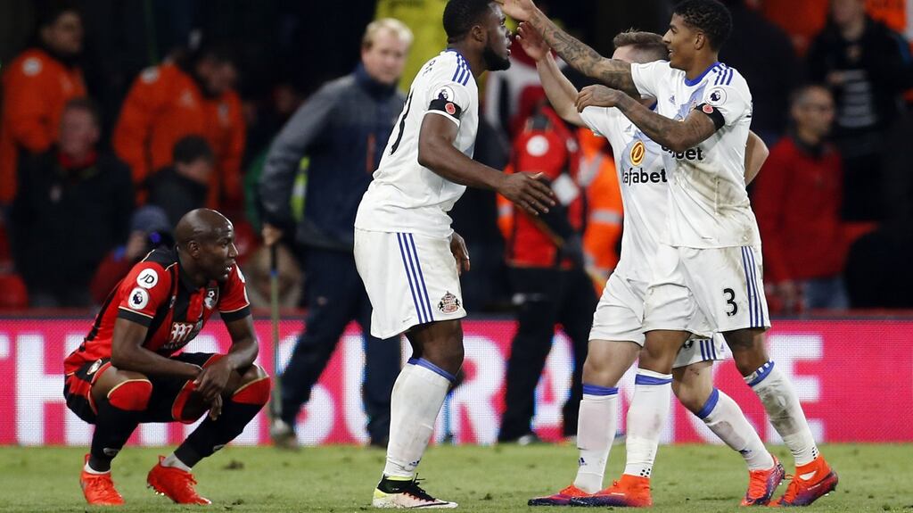 Sunderland’s Victor Anichebe and Patrick van Aanholt celebrate at full time in their Premier League win over Bournemouth. Photo: Matthew Childs/Reuters