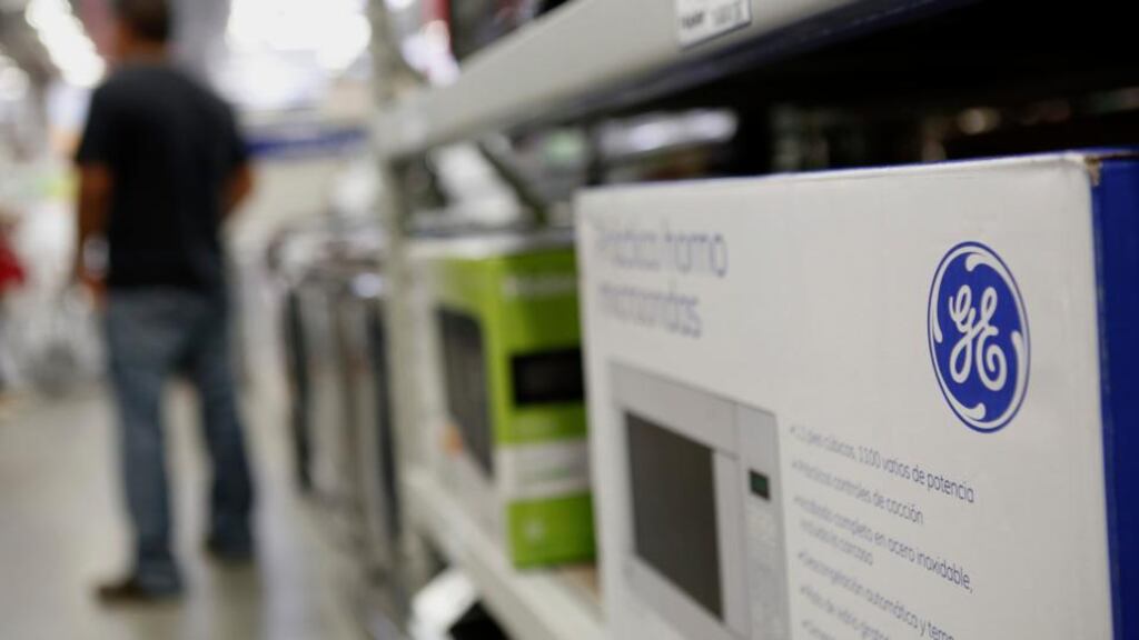 The General Electric logo is seen on a microwave oven. The company said its third-quarter profit and revenue fell. Photograph: Patrick T. Fallon/Bloomberg