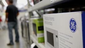 General Electric  results hit by finance arm