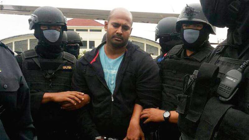 Indonesian police commandos escort Australian death row Myuran Sukumaran as he arrives in Cilacap in central Java island on his way to a maximum security prison in Nusa Kambangan island. Photograph: AFP/Getty Images