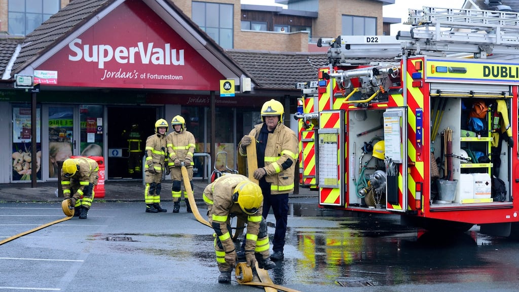 The scene at Fortunestown Shopping Centre in Tallaght on Thursday as fire fighters from Dublin Fire Briade controlled the fire. Photograph: Cyril Byrne/ The Irish Times