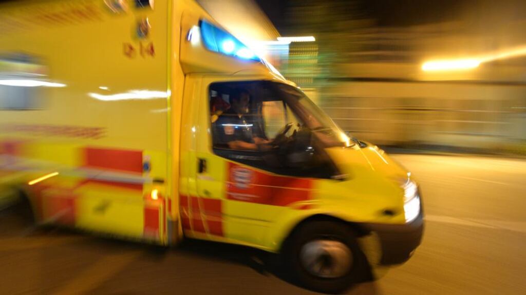 An ambulance arrives bringing a patient to medical staff working in a hospital’s accident and emergency department. Photograph: Alan Betson