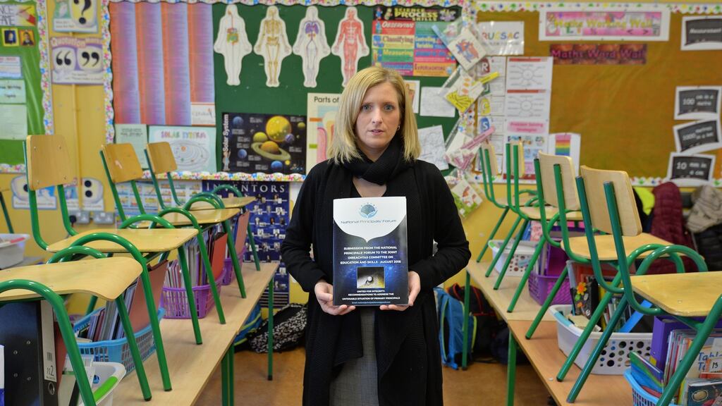 Angela Dunne, a teaching principal at Loughmore national school, Co Tipperary, with a copy of a research report produced by the National Principals’ Forum. Photograph: Alan Betson