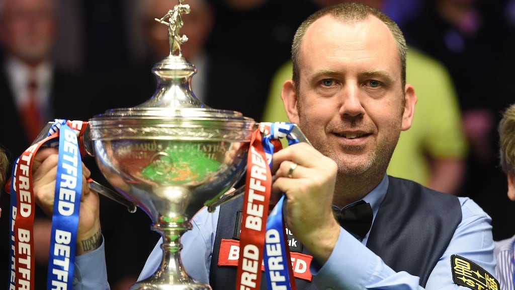 Mark Williams with the World Championship trophy after his win over Mark Higgins. Photograph: Paul Ellis/AFP