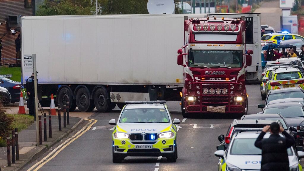 Police drive the tractor and trailer from the scene in Waterglade Industrial Park in Grays, Essex, Britain, on Wednesday. Photograph: Vickie Flores/EPA