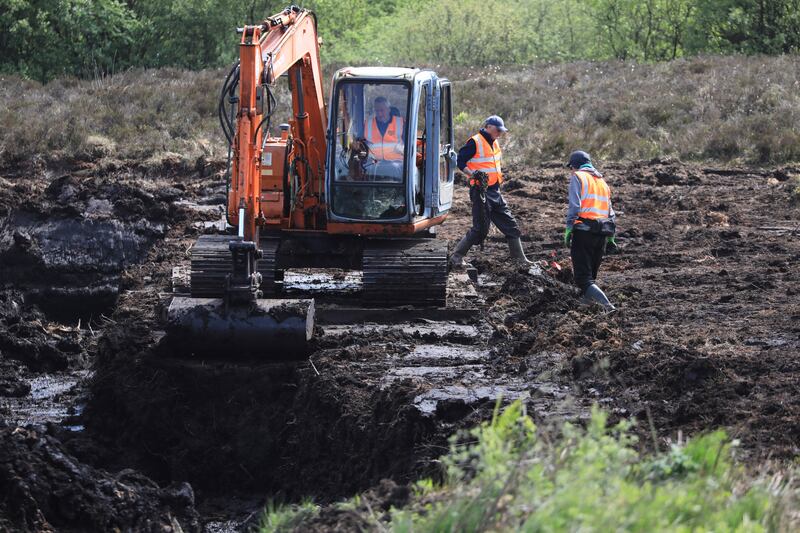 Members of the Independent Commission for the Location of Victims' Remains search Bragan Bog in Co Monaghan for missing teenager Columba McVeigh. Photograph: Peter Morrison/PA Wire