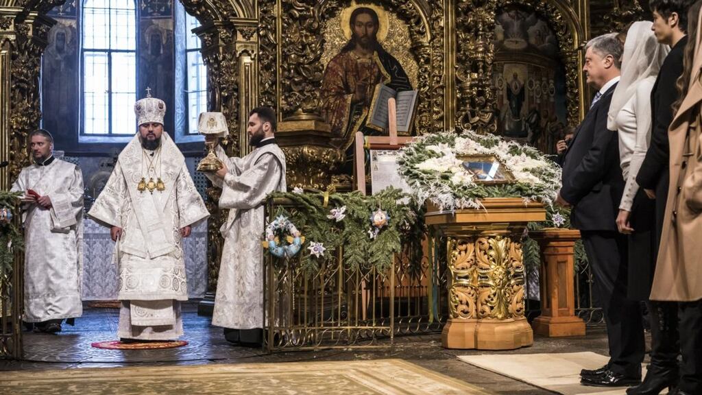 Metropolitan Epifaniy (second from left), participates in Christmas liturgy with Ukrainian president Petro Poroshenko (fourth from right) at St Sophia’s cathedral in Kiev on Monday. Photograph: Brendan Hoffman/Getty Images
