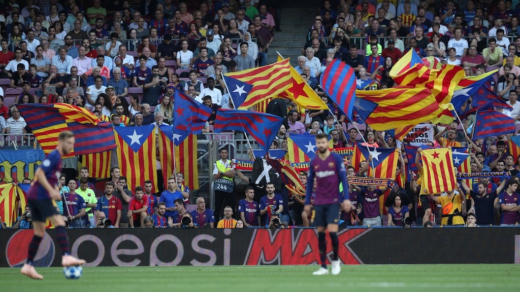 Barcelona fans with their Catalan flags at Camp Nou. Photograph: Albert Gea/Reuters