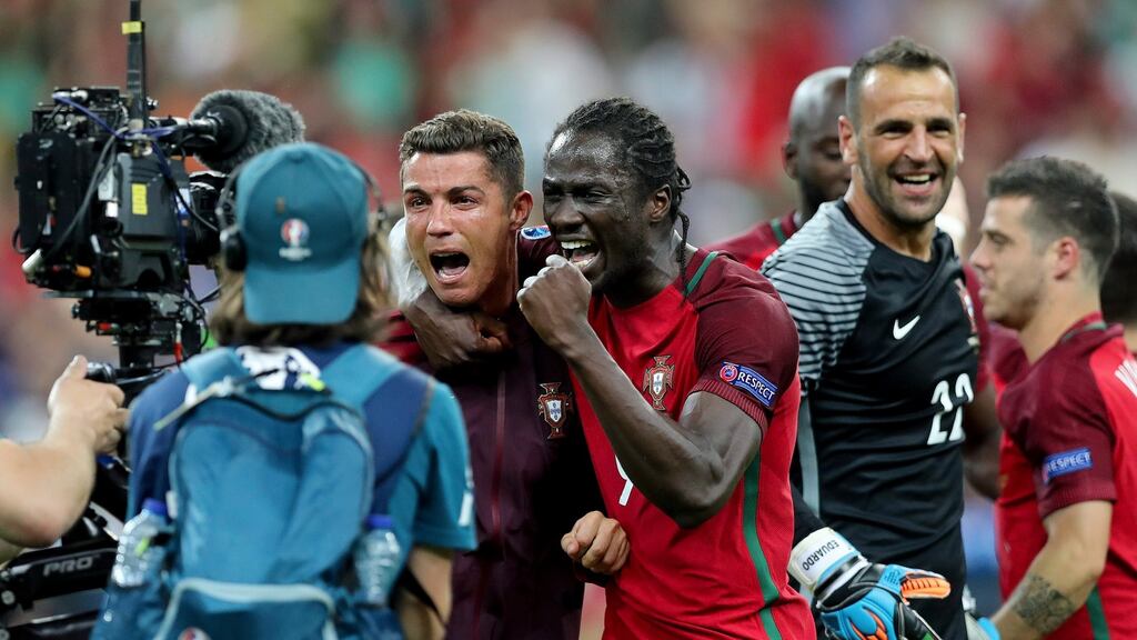 Portugal’s Cristiano Ronaldo and Eder celebrate their team’s victory in Stade de France. Photograph: EPA