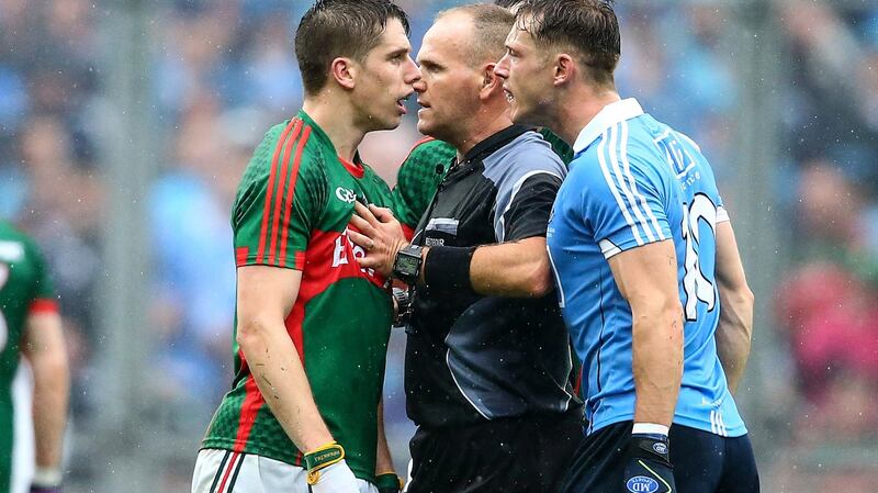 Referee Conor Lane keeps Mayo's Lee Keegan and Dublin’s Paul Flynn apart during the 2016 All-Ireland Final at Croke Park. Photograph: Cathal Noonan/Inpho