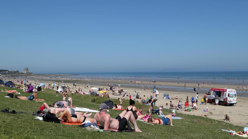 People enjoying the soaring temperatures at Portmarnock Beach in Dublin. Photograph: Collins