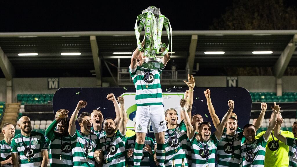 Shamrock Rovers captain Ronan Finn lifts the SSE Airtricity League Premier Division trophy after the game against St Patrick’s Athletic at Tallaght Stadium. Photograph: Morgan Treacy/Inpho