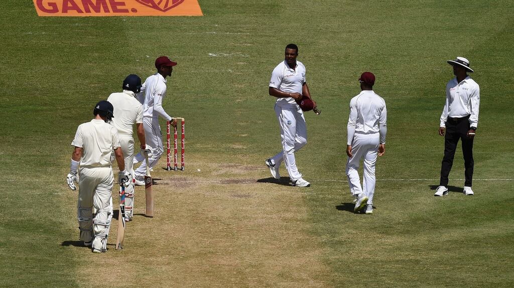 Shannon Gabriel of West Indies exchanges words with Joe Root and Joe Denly of England during day three of the third Test in St Lucia. Photo: Shaun Botterill/Getty Images