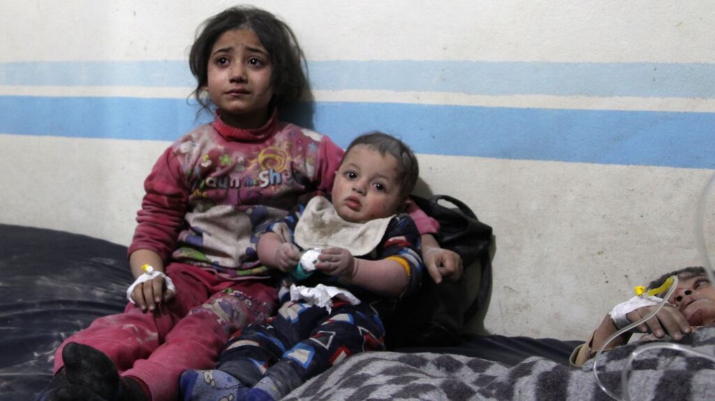 Wounded Syrian children receive treatment at a makeshift hospital following a reported airstrike on the industrial area of Idlib, in Northern Syria. Photograph: Abdulaziz Ketaz/AFP/Getty