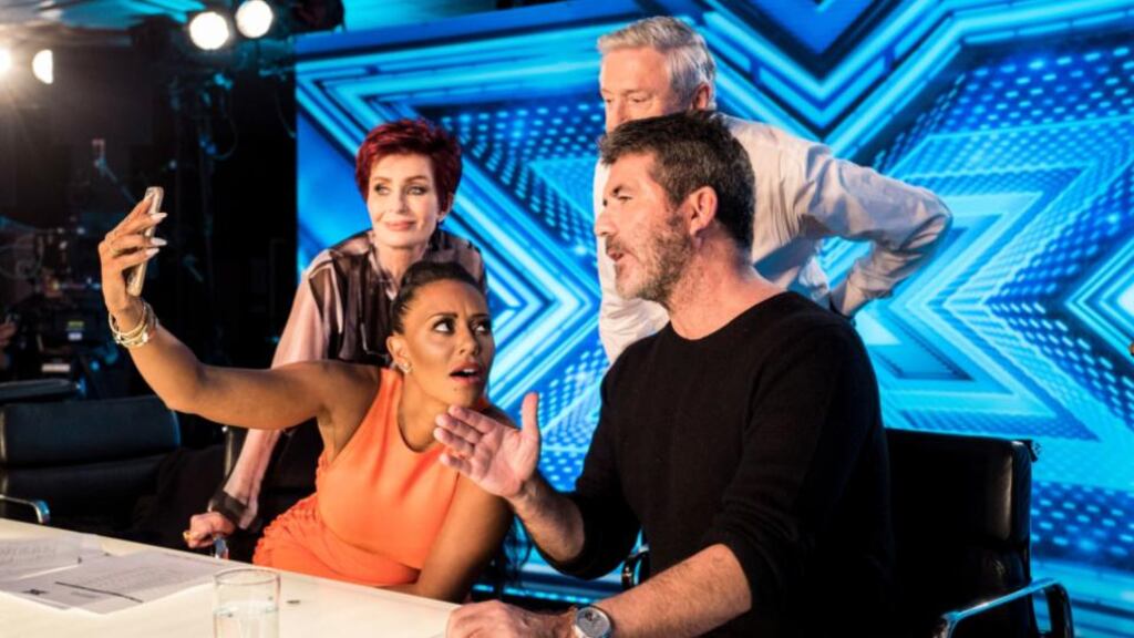 ‘X Factor’ judges Sharon Osbourne (left) Louis Walsh and Simon Cowell (right) with Spice Girls singer Mel B (second left).